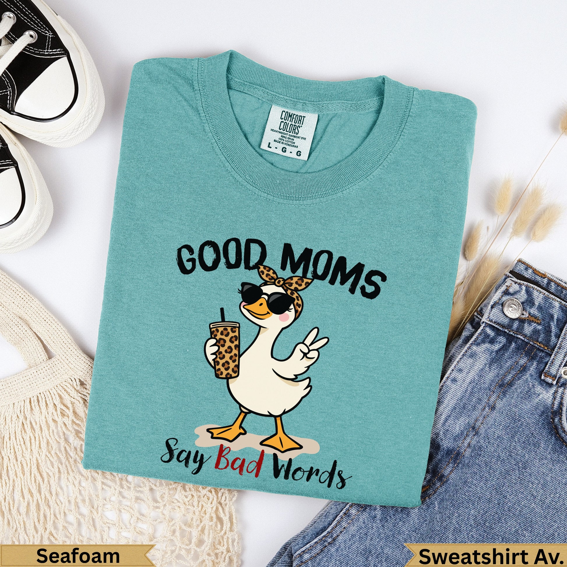 Teal t-shirt with cartoon duck, sunglasses, and text "Good Moms Say Bad Words".