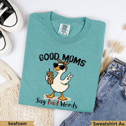 Teal t-shirt with cartoon duck, sunglasses, and text "Good Moms Say Bad Words".