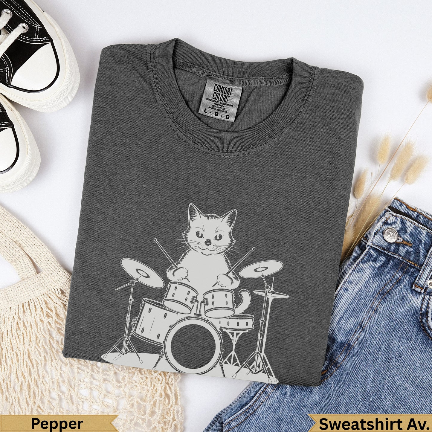 Dark grey graphic t-shirt with a cat playing drums, labeled "Pepper".