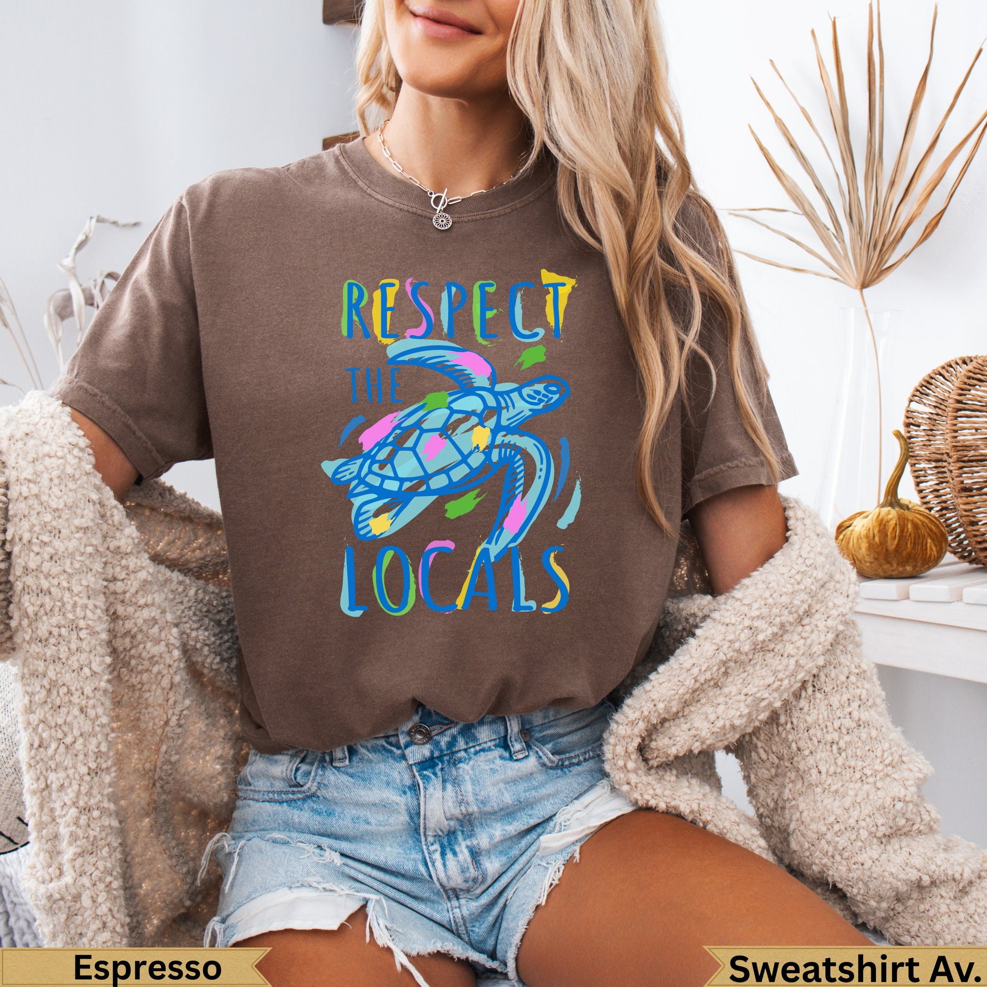 Brown sweatshirt with colorful sea turtle graphic and "Respect the Locals" text.