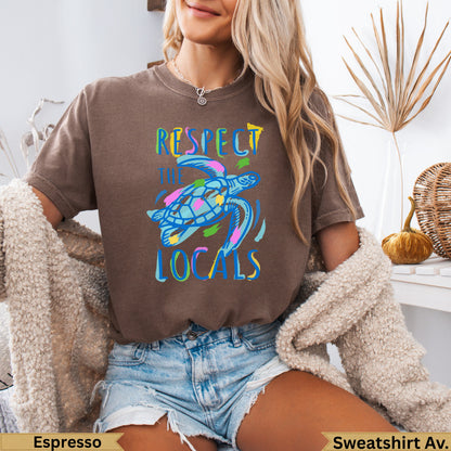 Brown sweatshirt with colorful sea turtle graphic and "Respect the Locals" text.