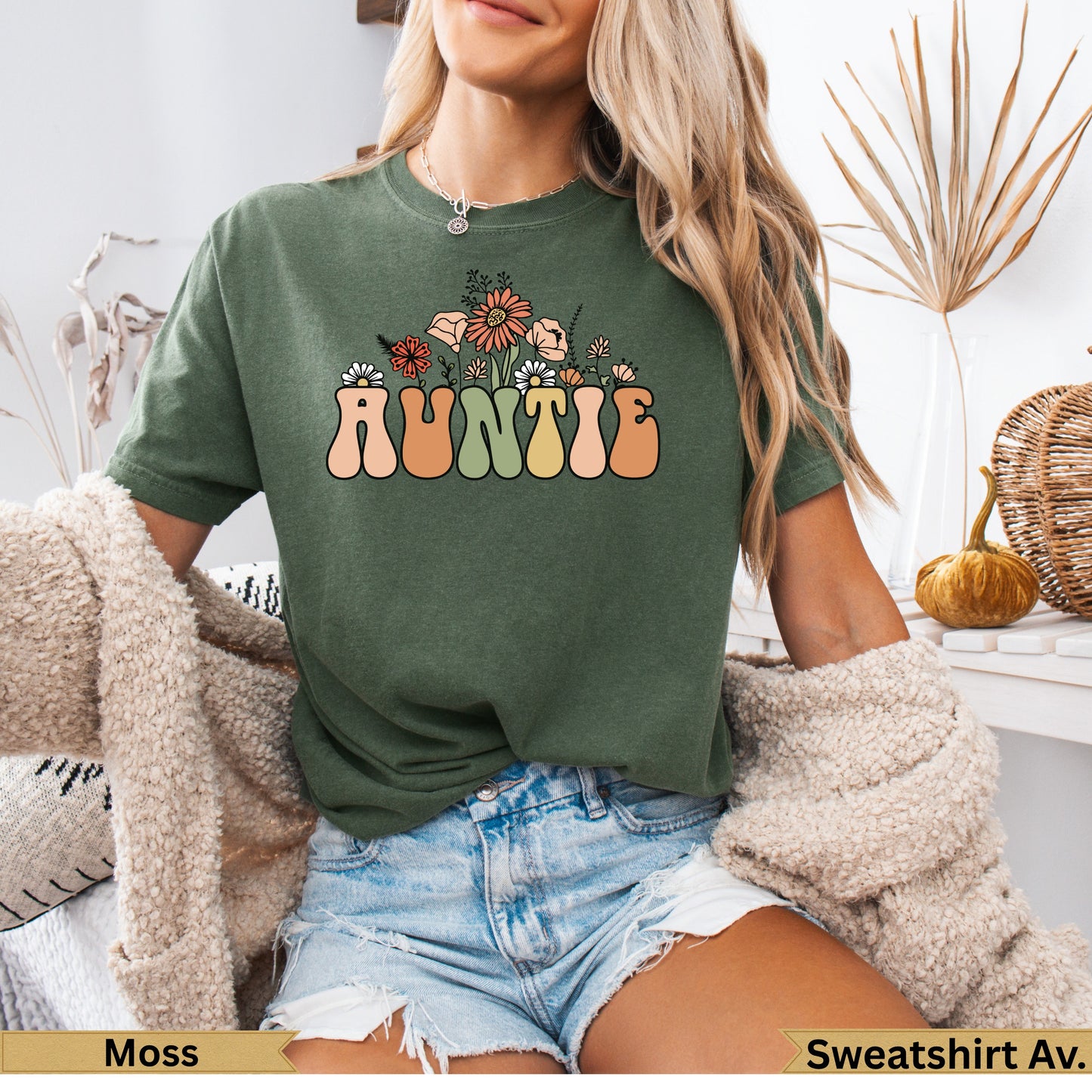 Green t-shirt with "AUNTIE" in floral lettering.