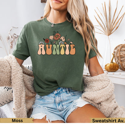 Green t-shirt with "AUNTIE" in floral lettering.