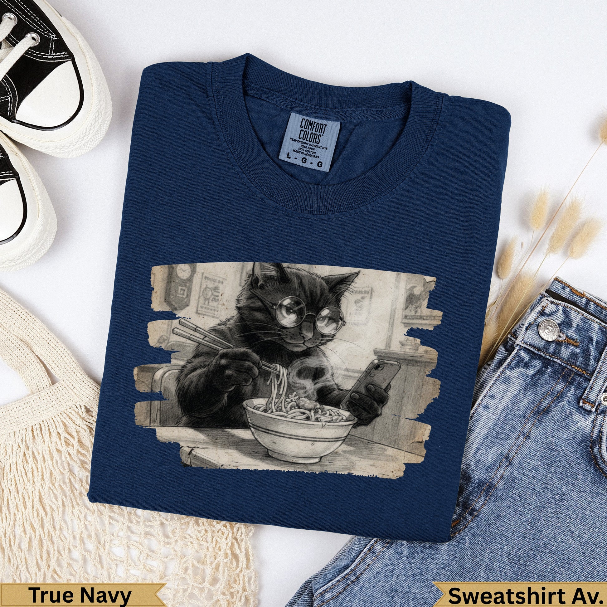 Black cat wearing glasses eats noodles while looking at phone.