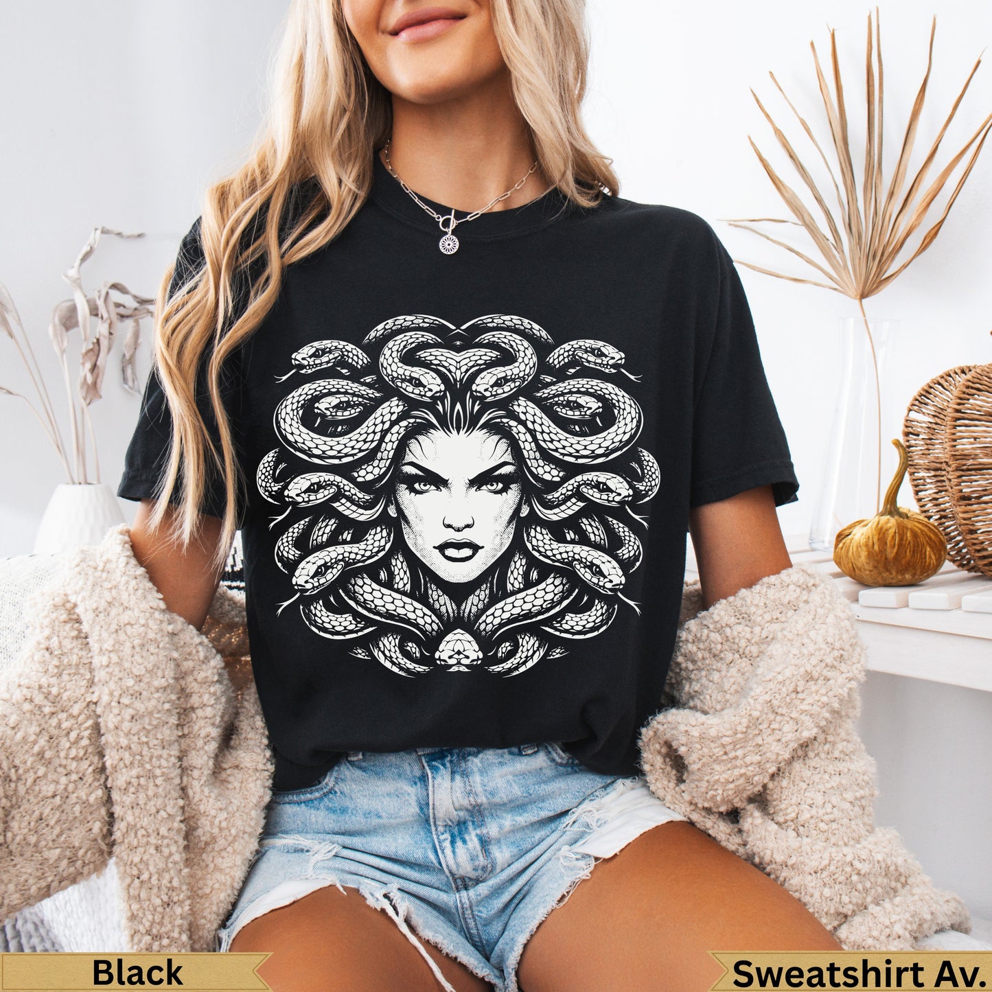 Black t-shirt with Medusa graphic print.