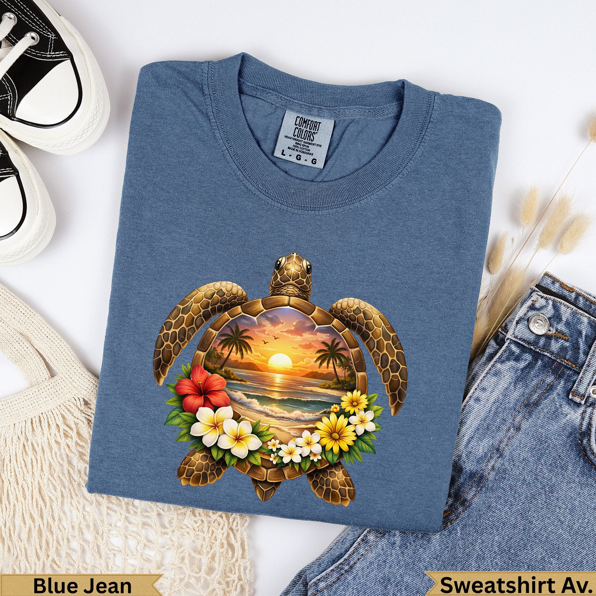 Blue t-shirt with a sea turtle and tropical sunset design, labeled "Blue Jean".