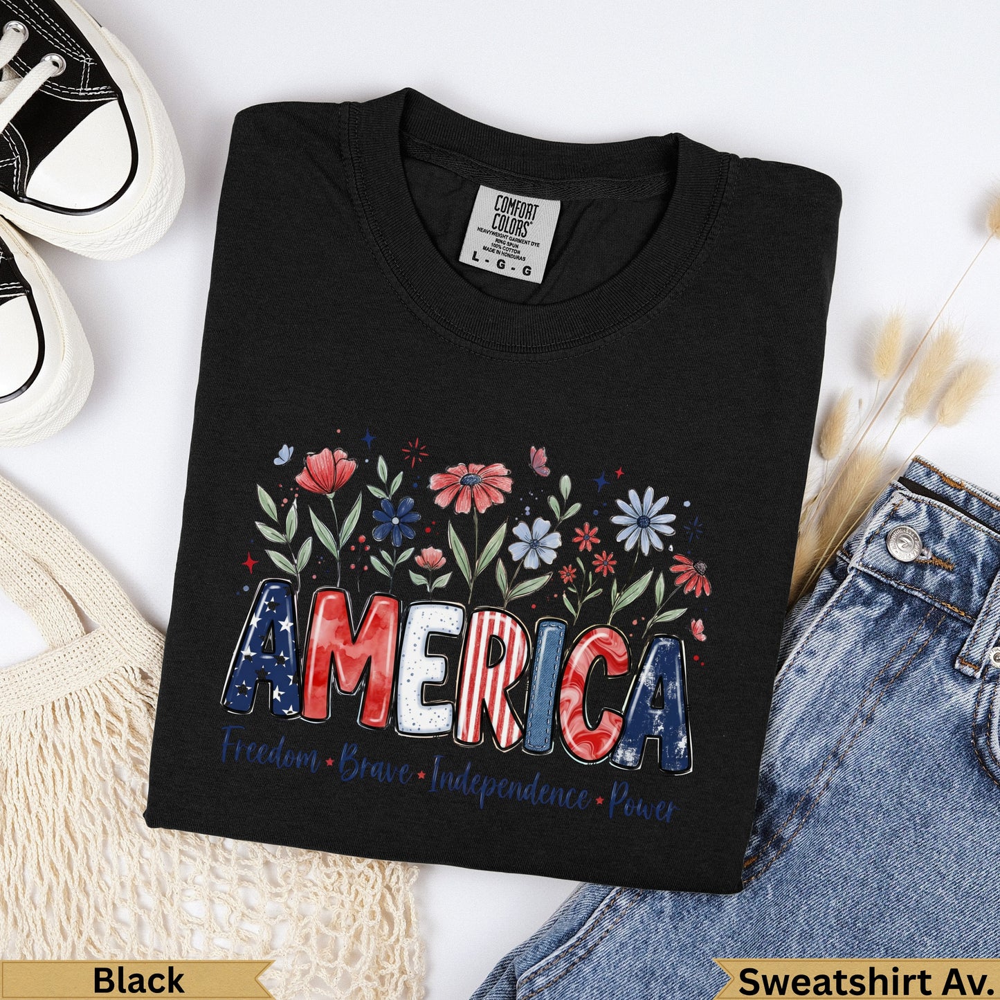 Black Comfort Colors sweatshirt with "AMERICA" text and floral design.