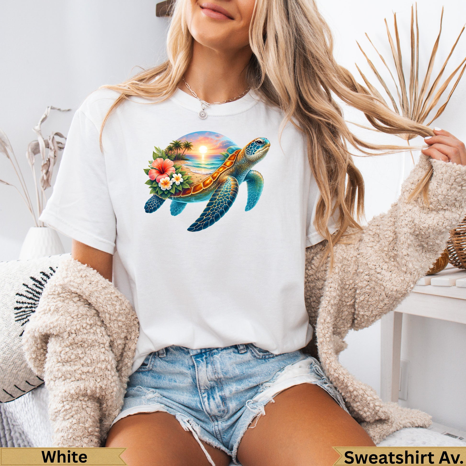 White t-shirt with a sea turtle and sunset graphic.