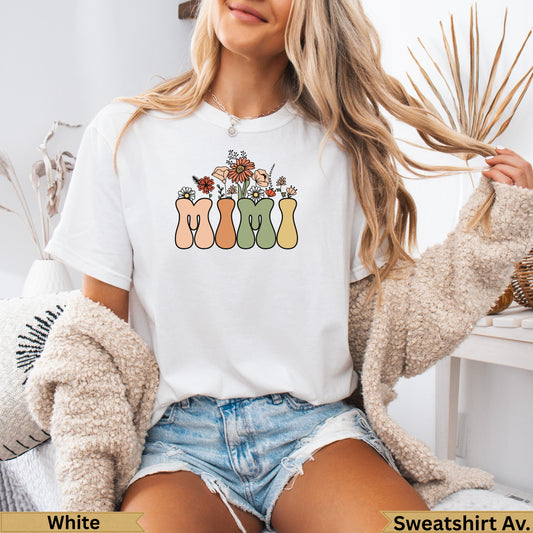 White t-shirt with "Mimi" in pastel letters and floral accents.