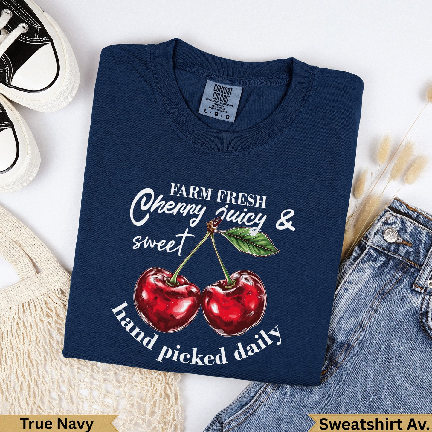 Navy blue Comfort Colors t-shirt with cherries and text "Farm Fresh Cherry juicy & sweet hand picked daily".