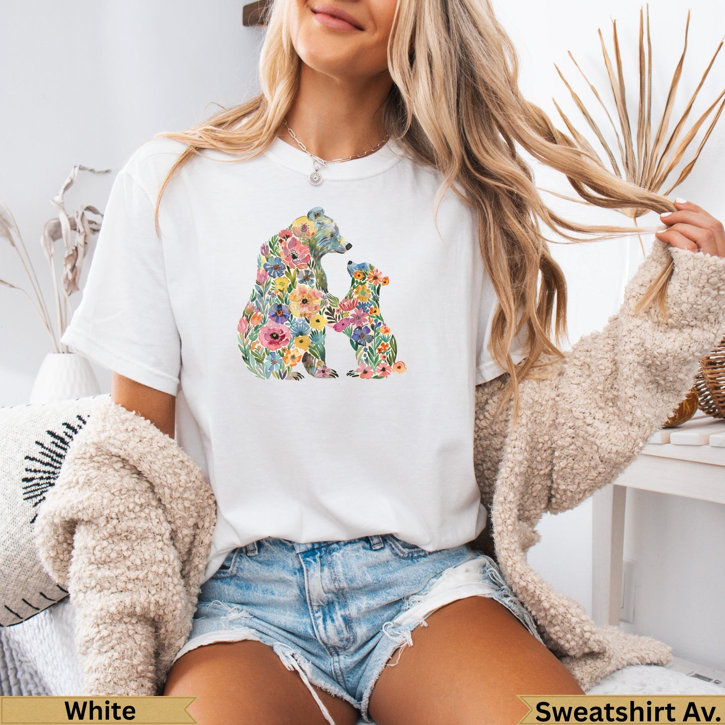 White t-shirt with a floral bear and cub design.