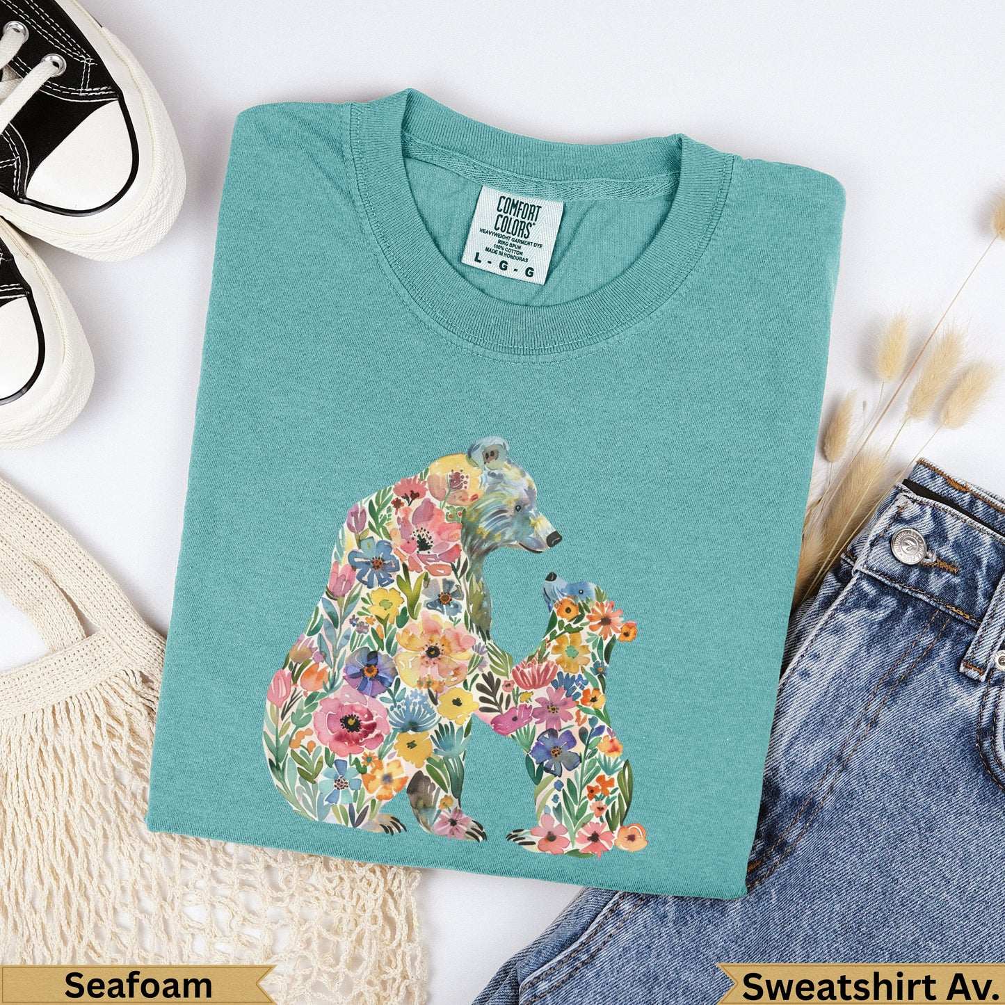 Teal sweatshirt with floral bear and cub design, labeled "Seafoam".