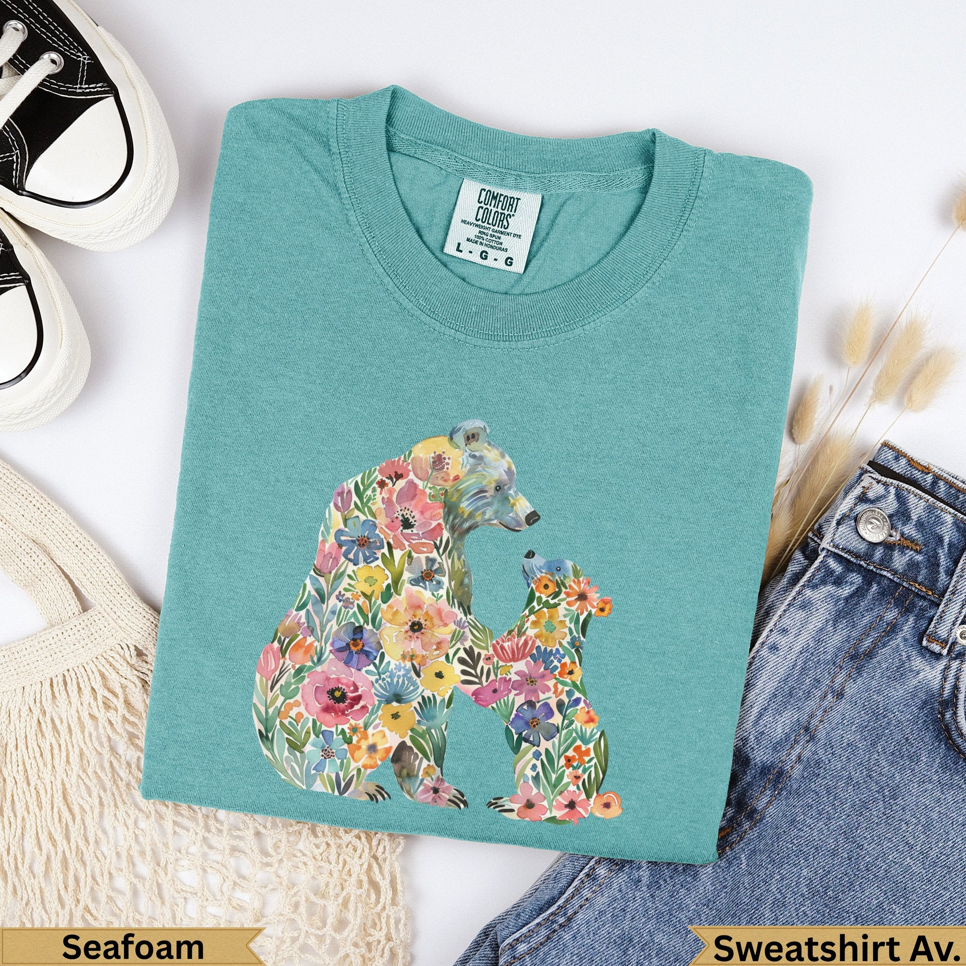 Teal sweatshirt with floral bear and cub design, labeled "Seafoam".
