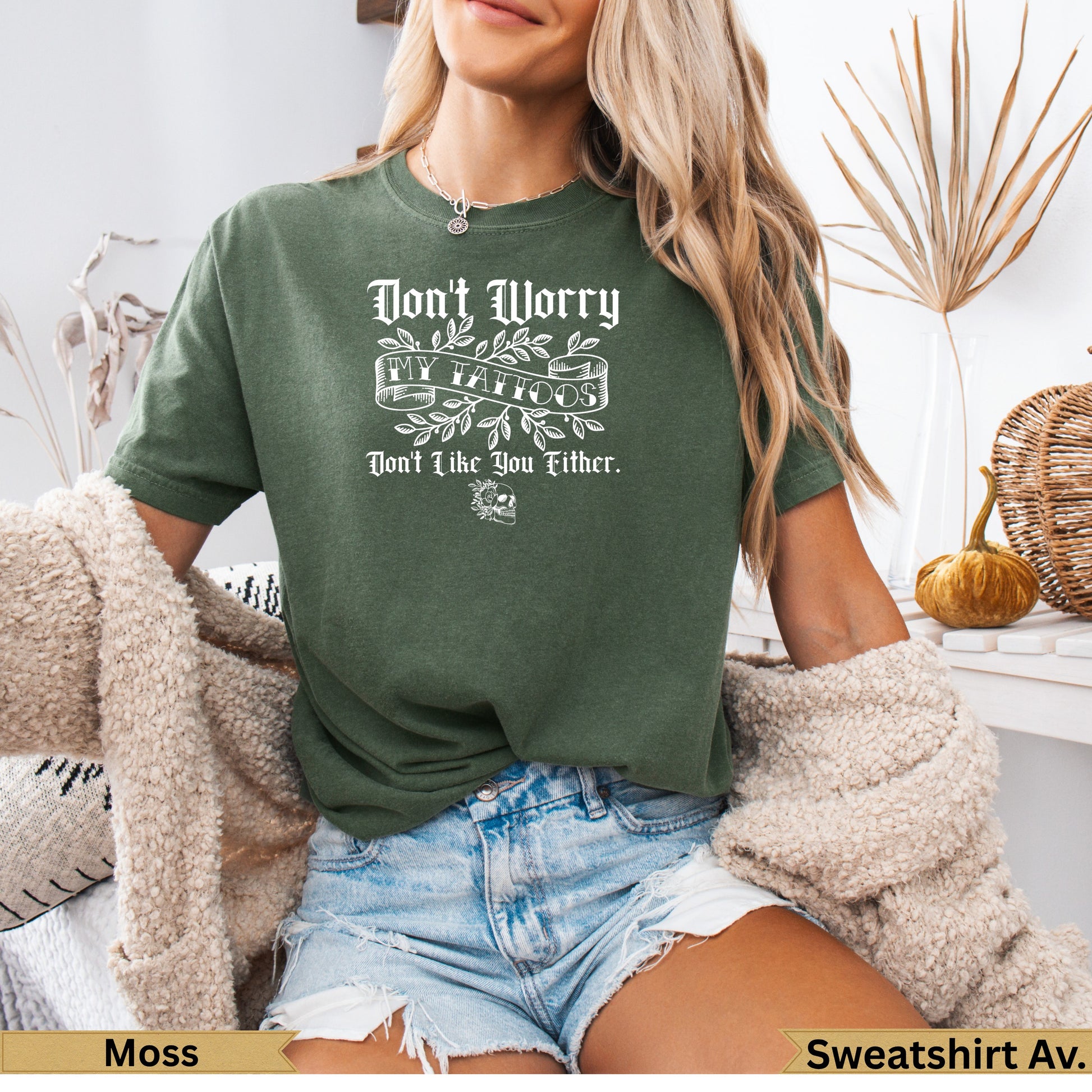 Green t-shirt with "Don't Worry I Tattoo You" text.