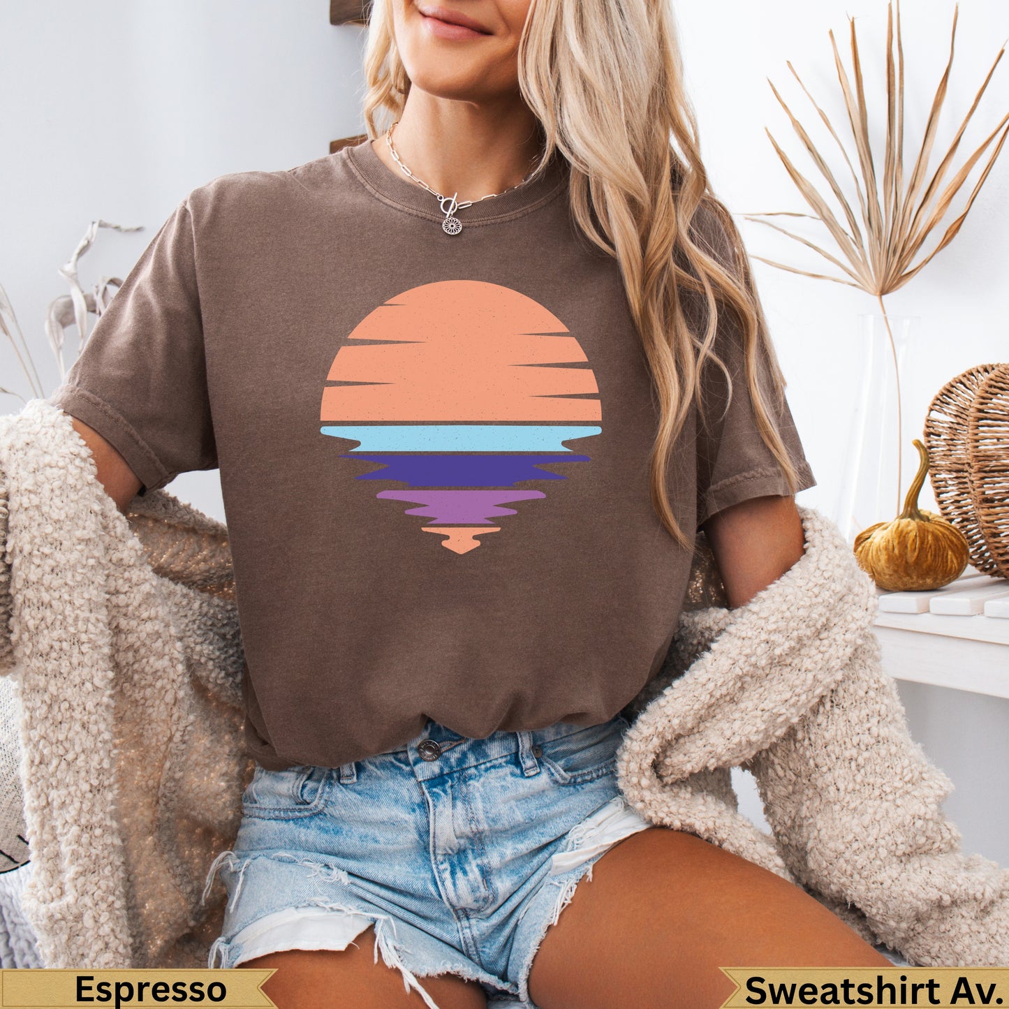 Brown t-shirt with abstract sunset reflection graphic.