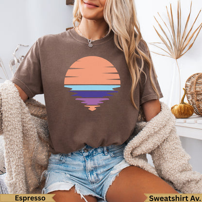 Brown t-shirt with abstract sunset reflection graphic.