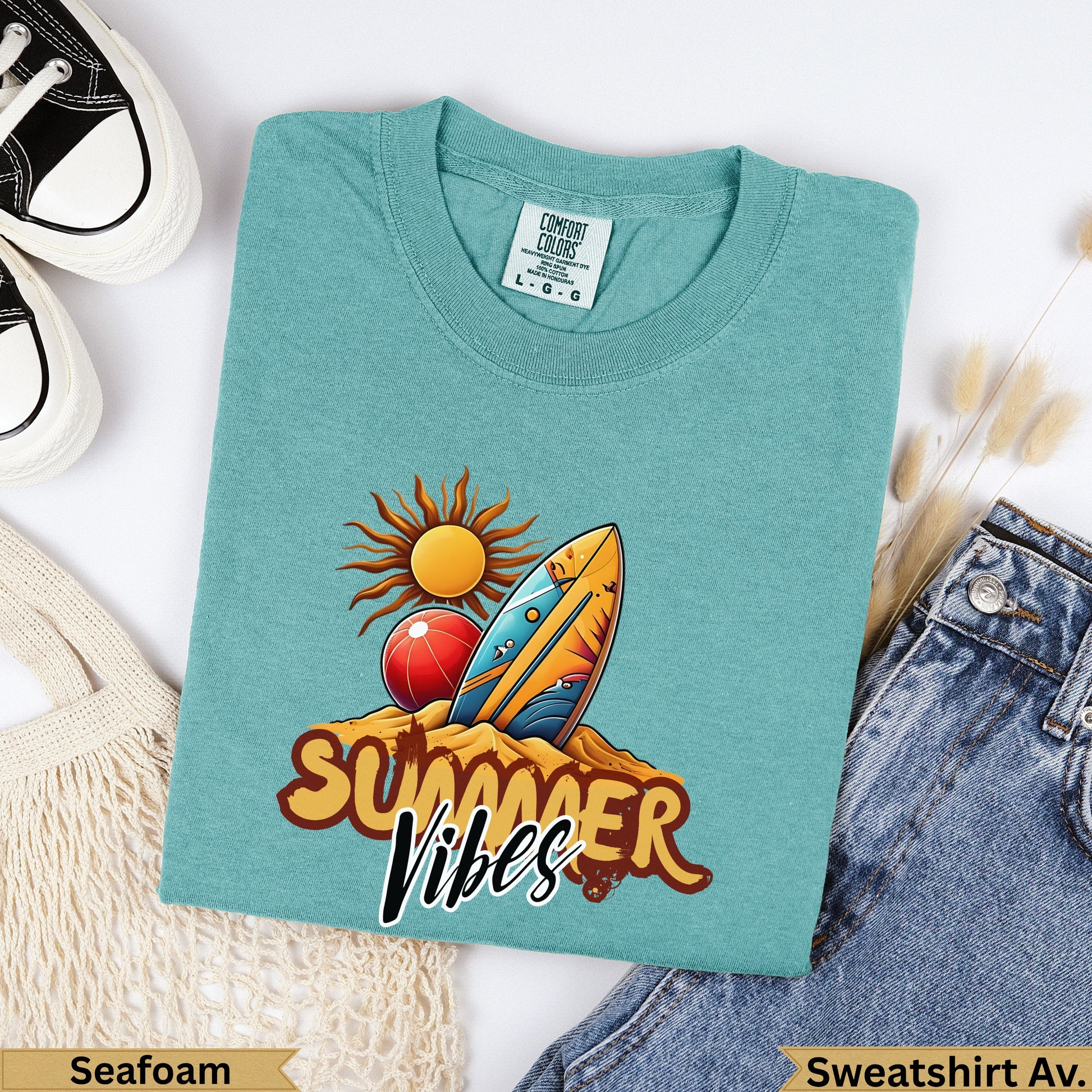 Teal crewneck sweatshirt with "Summer Vibes" graphic of sun, beach ball, and surfboard.