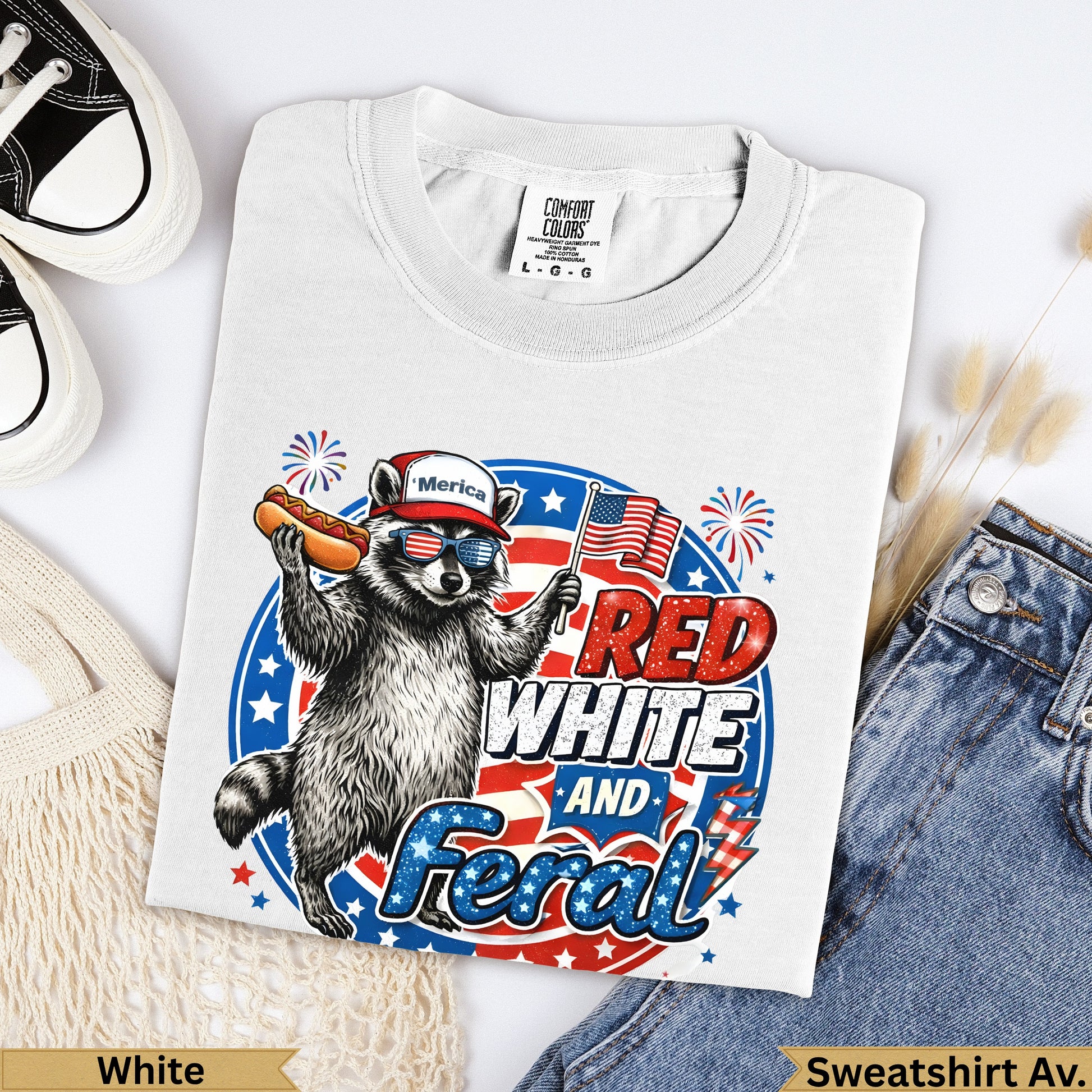 Raccoon wearing sunglasses and hat, holding hot dog and American flag, "RED WHITE AND F***"