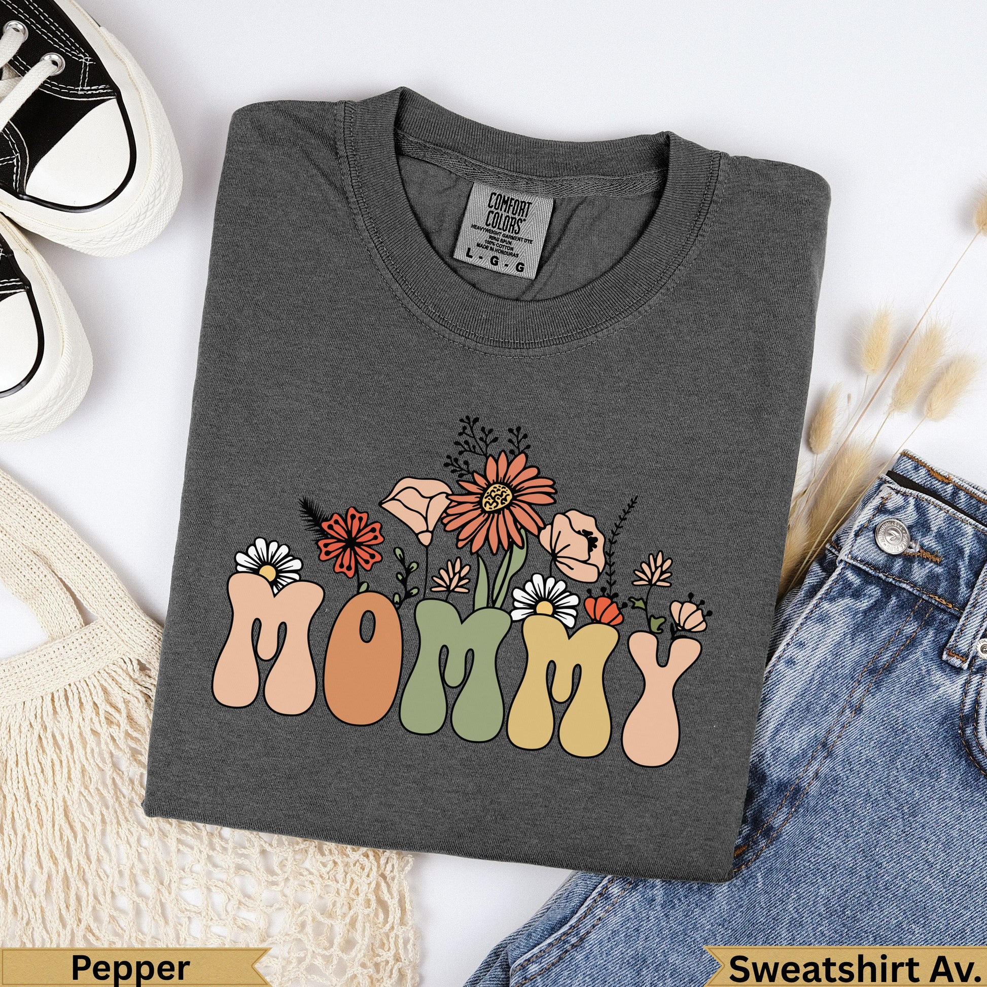 Dark gray t-shirt with "MOMMY" in colorful floral letters.