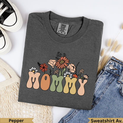 Dark gray t-shirt with "MOMMY" in colorful floral letters.