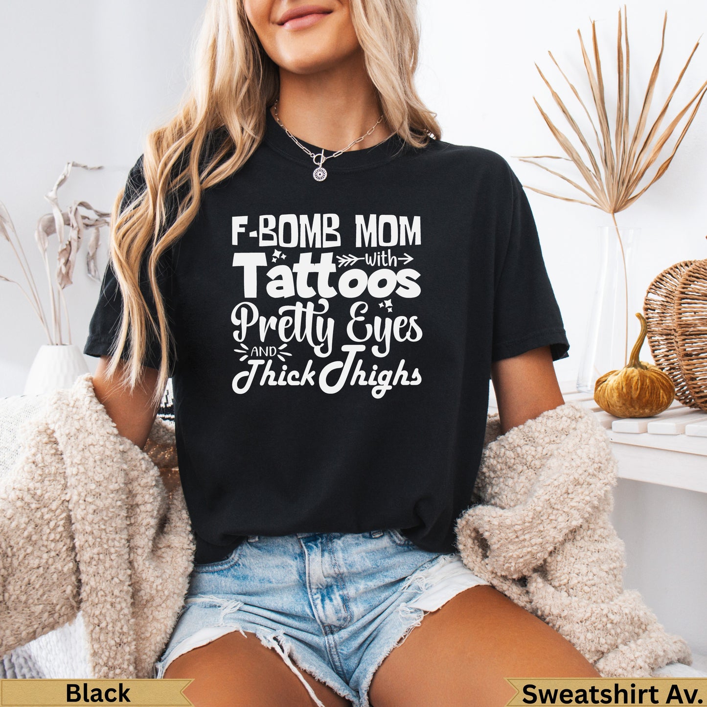 Black t-shirt with white text "F-BOMB MOM with Pretty Eyes and Thick Thighs".