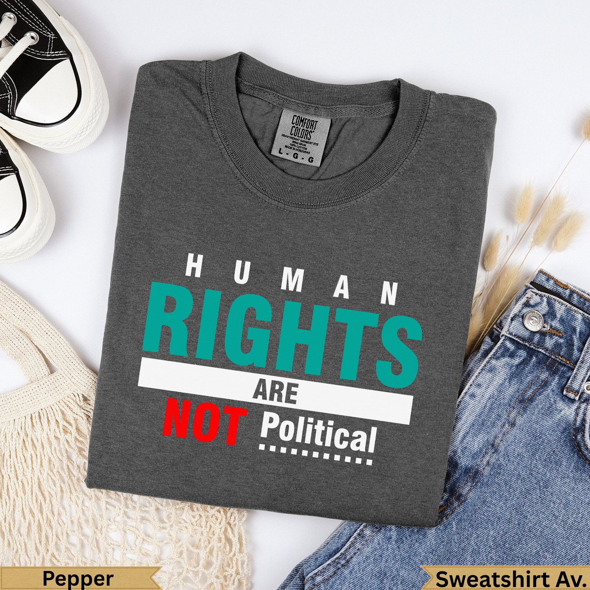 Dark grey sweatshirt with "Human Rights Are Not Political" in teal and red text.
