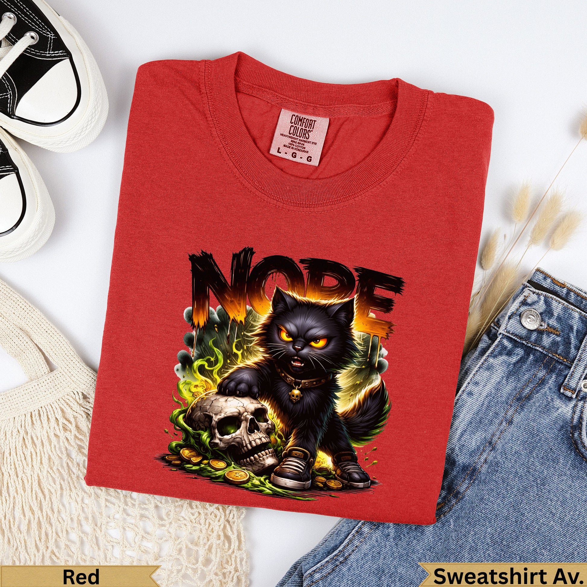 Red t-shirt with black cat, skull, and gold coins graphic, "NOPE" text.