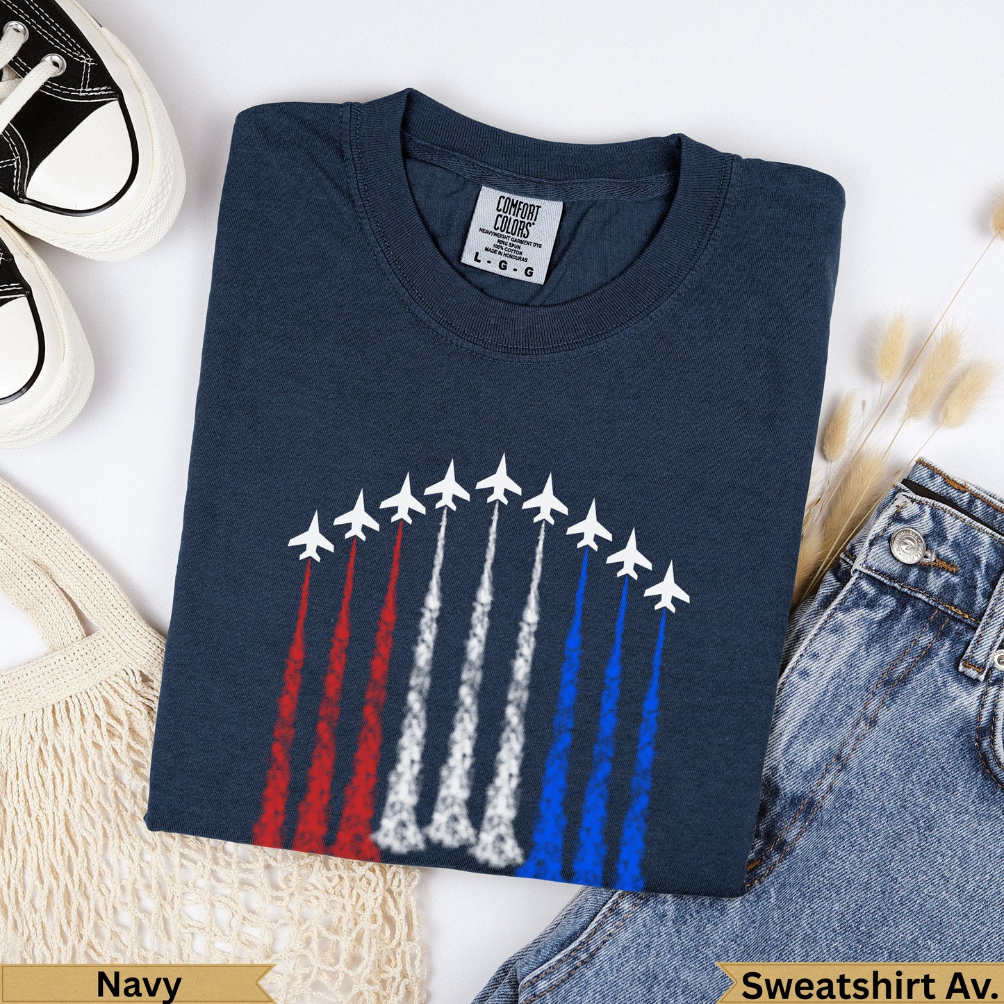 Navy crewneck t-shirt with white fighter jets leaving red, white, and blue trails.