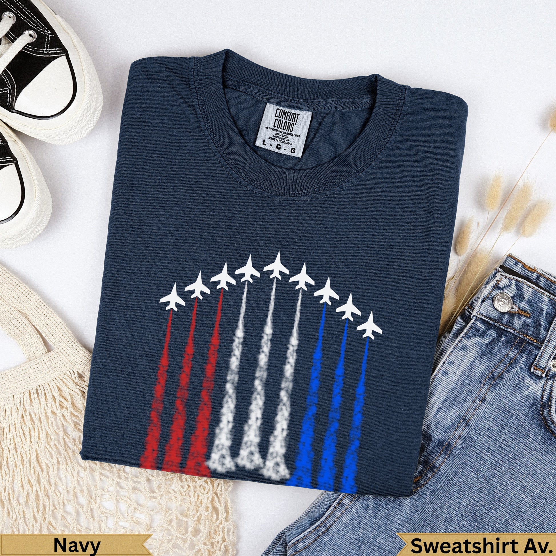 Navy crewneck t-shirt with white fighter jets leaving red, white, and blue trails.