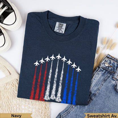 Navy crewneck t-shirt with white fighter jets leaving red, white, and blue trails.