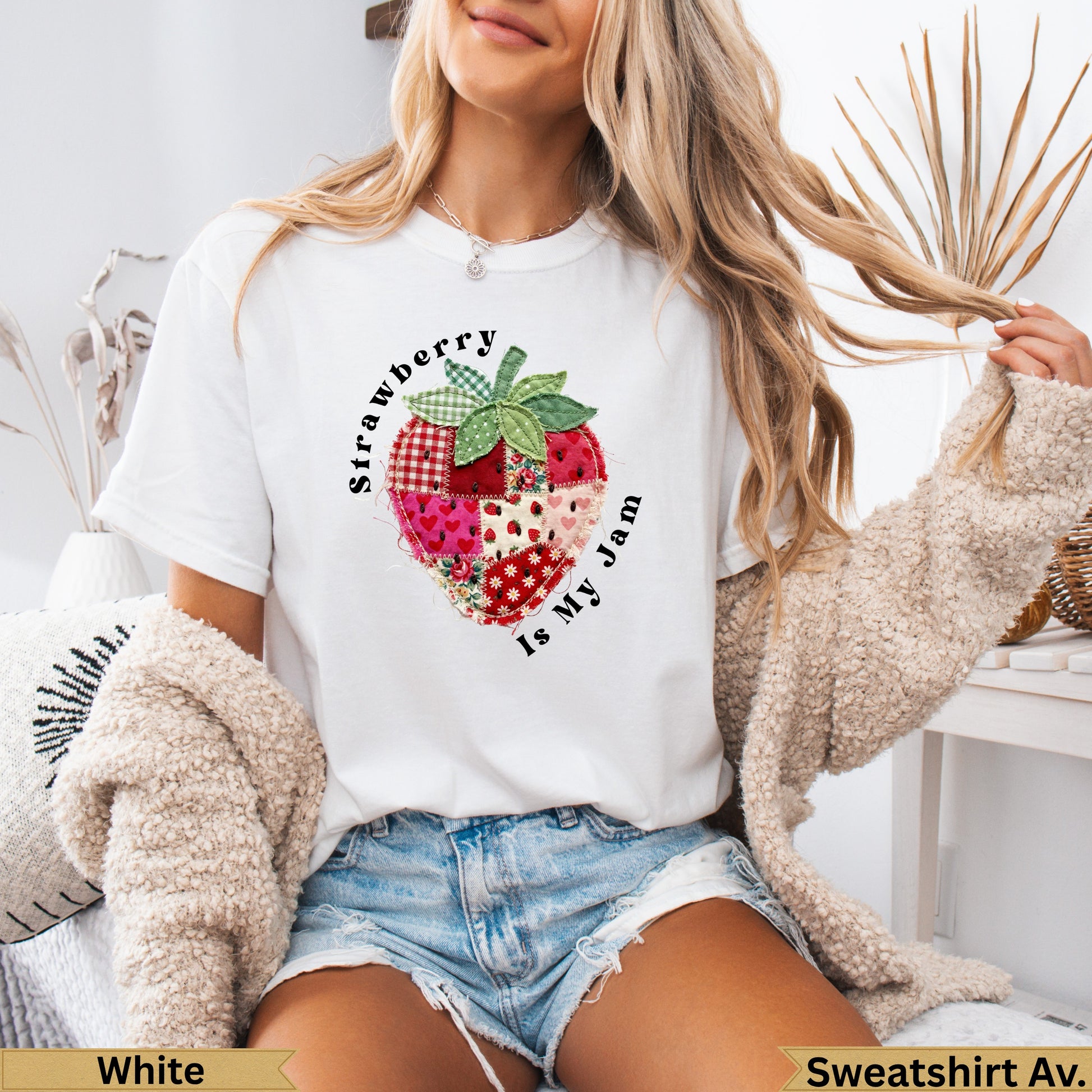 White t-shirt with a patchwork strawberry graphic and text "Strawberry Is My Jam".