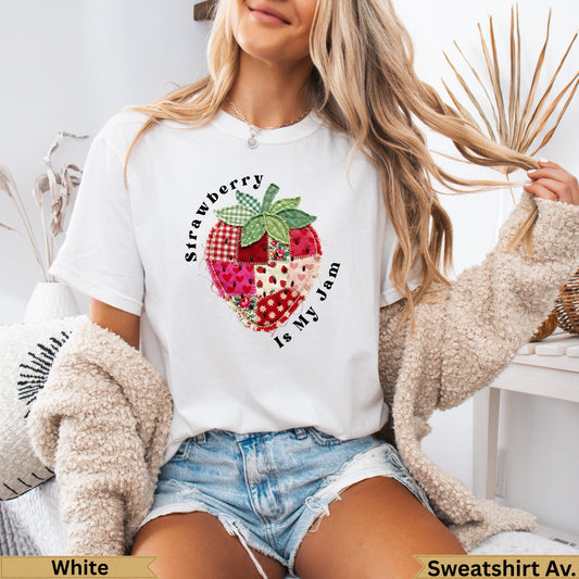 White t-shirt with a patchwork strawberry graphic and text "Strawberry Is My Jam".