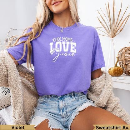 Violet sweatshirt with "Cool Moms Love Jesus" text.