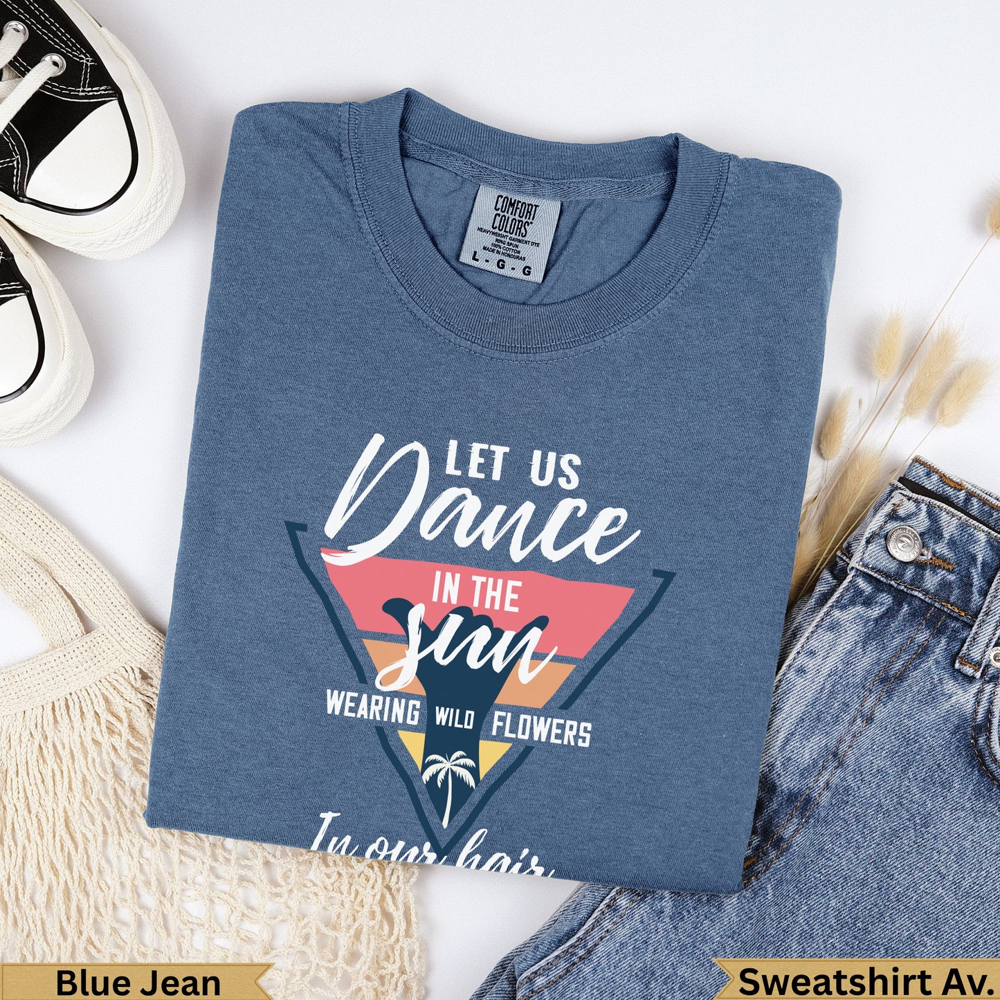 Blue Jean Comfort Colors sweatshirt with "Let Us Dance In The Sun Wearing Wild Flowers" text.