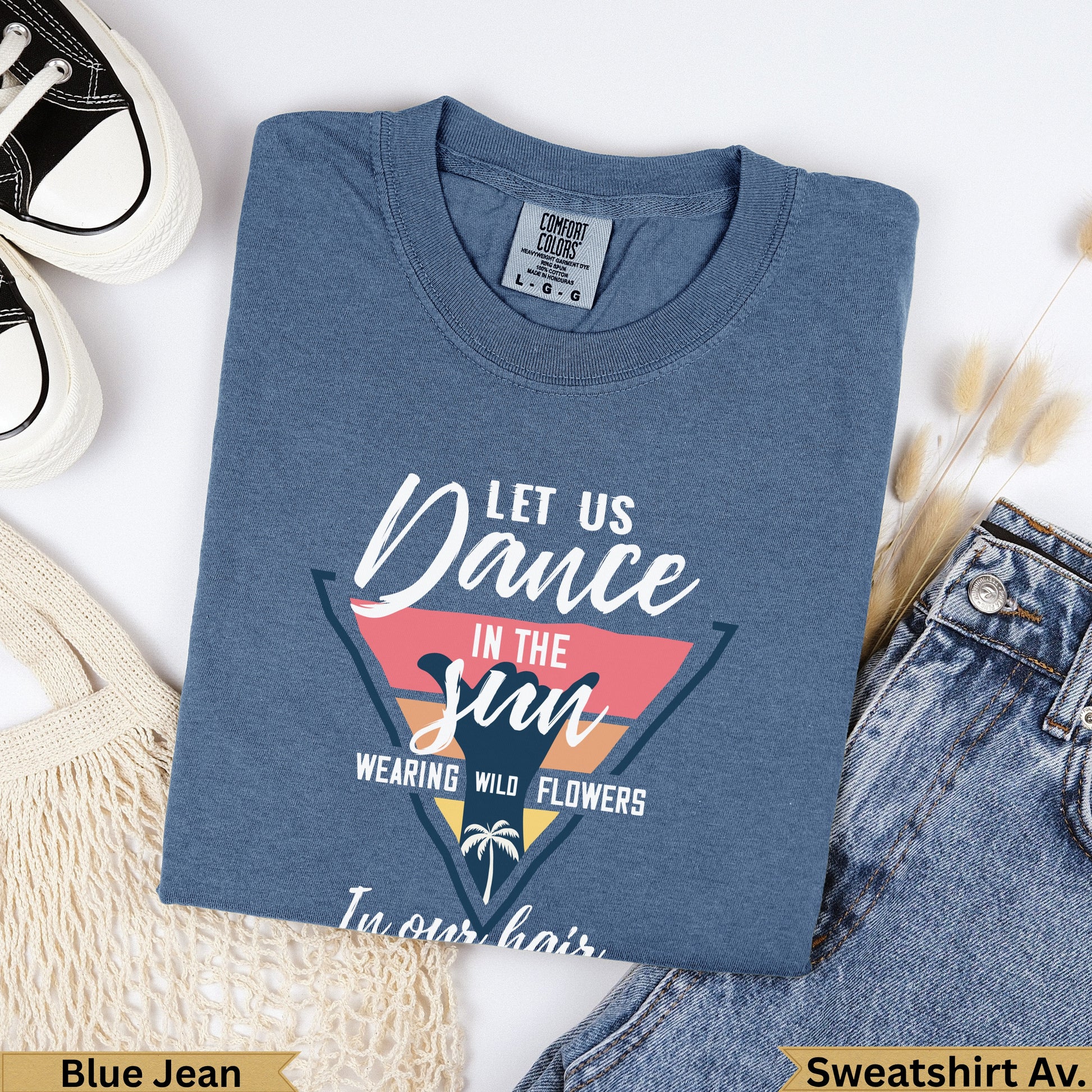 Blue Jean Comfort Colors sweatshirt with "Let Us Dance In The Sun Wearing Wild Flowers" text.