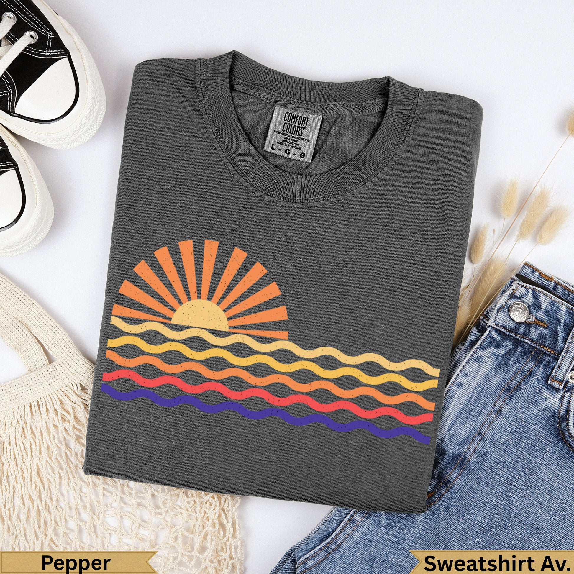 Dark gray t-shirt with a sun and wavy stripe graphic.