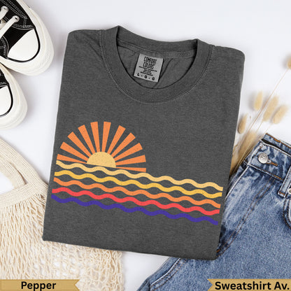 Dark gray t-shirt with a sun and wavy stripe graphic.