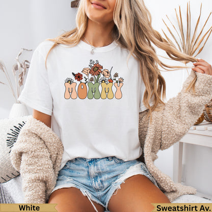 White t-shirt with "Mommy" in colorful floral lettering.