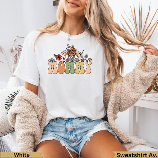 White t-shirt with "Mommy" in colorful floral lettering.