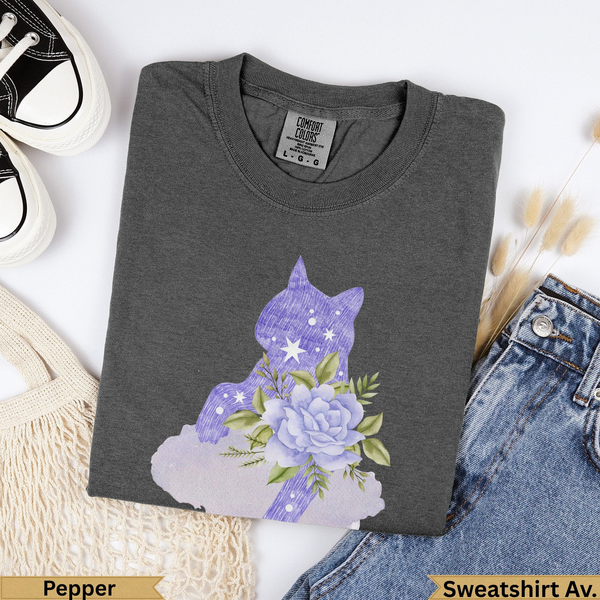 Dark gray t-shirt with a purple cat silhouette and floral design.