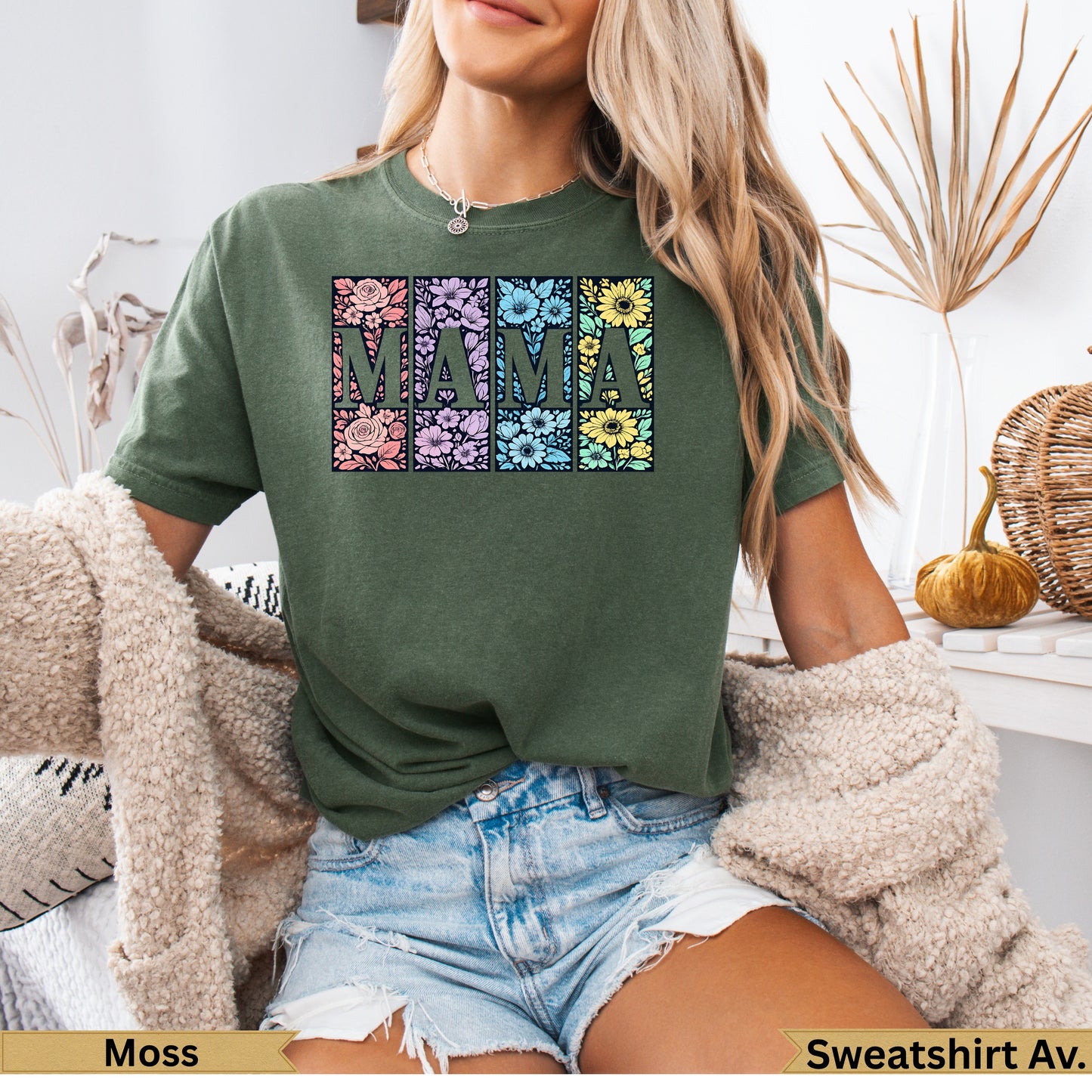 Green t-shirt with "MAMA" spelled in floral squares on chest.