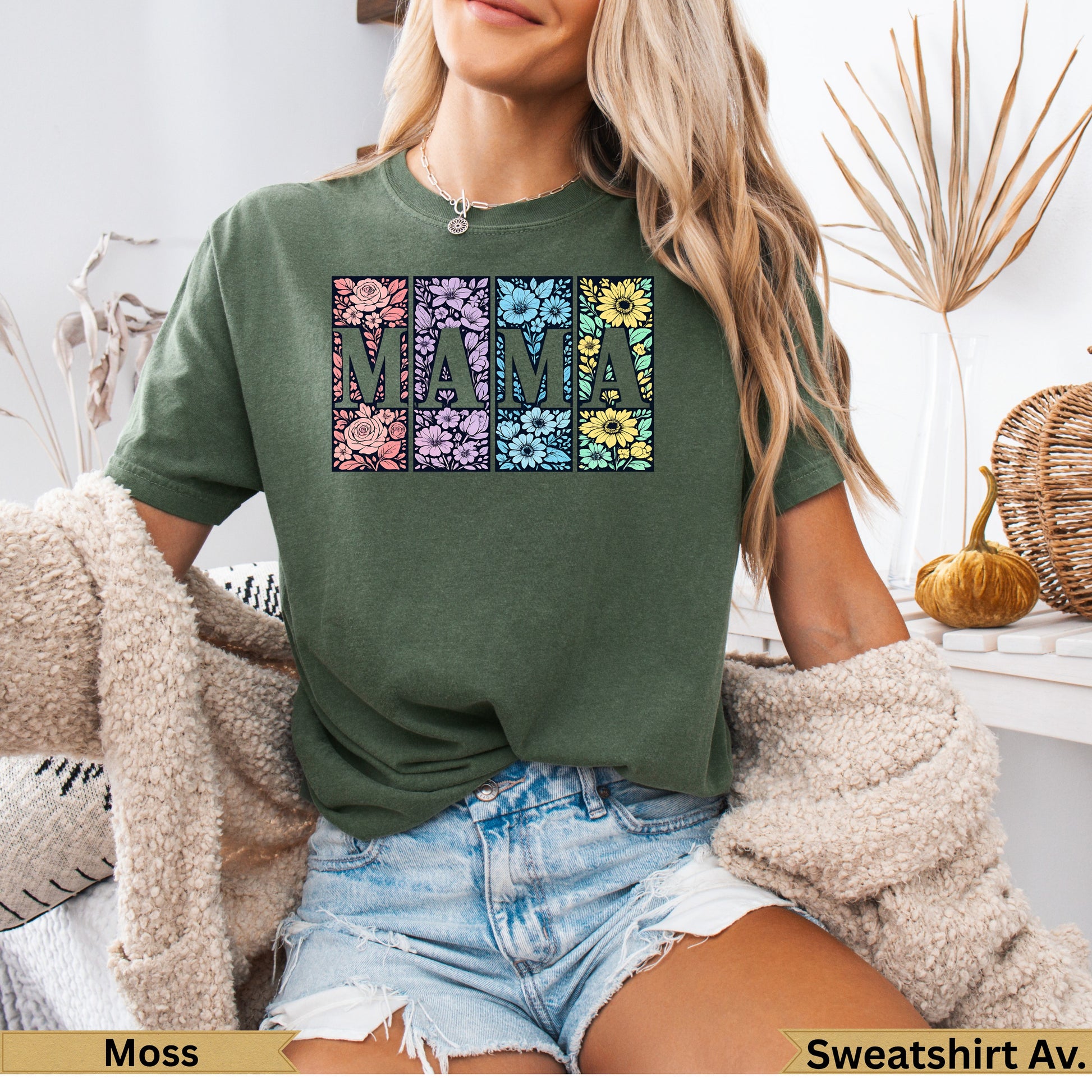 Green t-shirt with "MAMA" spelled in floral squares on chest.