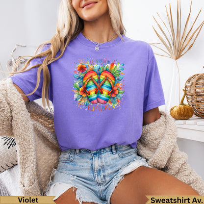 Purple t-shirt with rainbow flip flops graphic and text "Life is Better in Flip Flops".