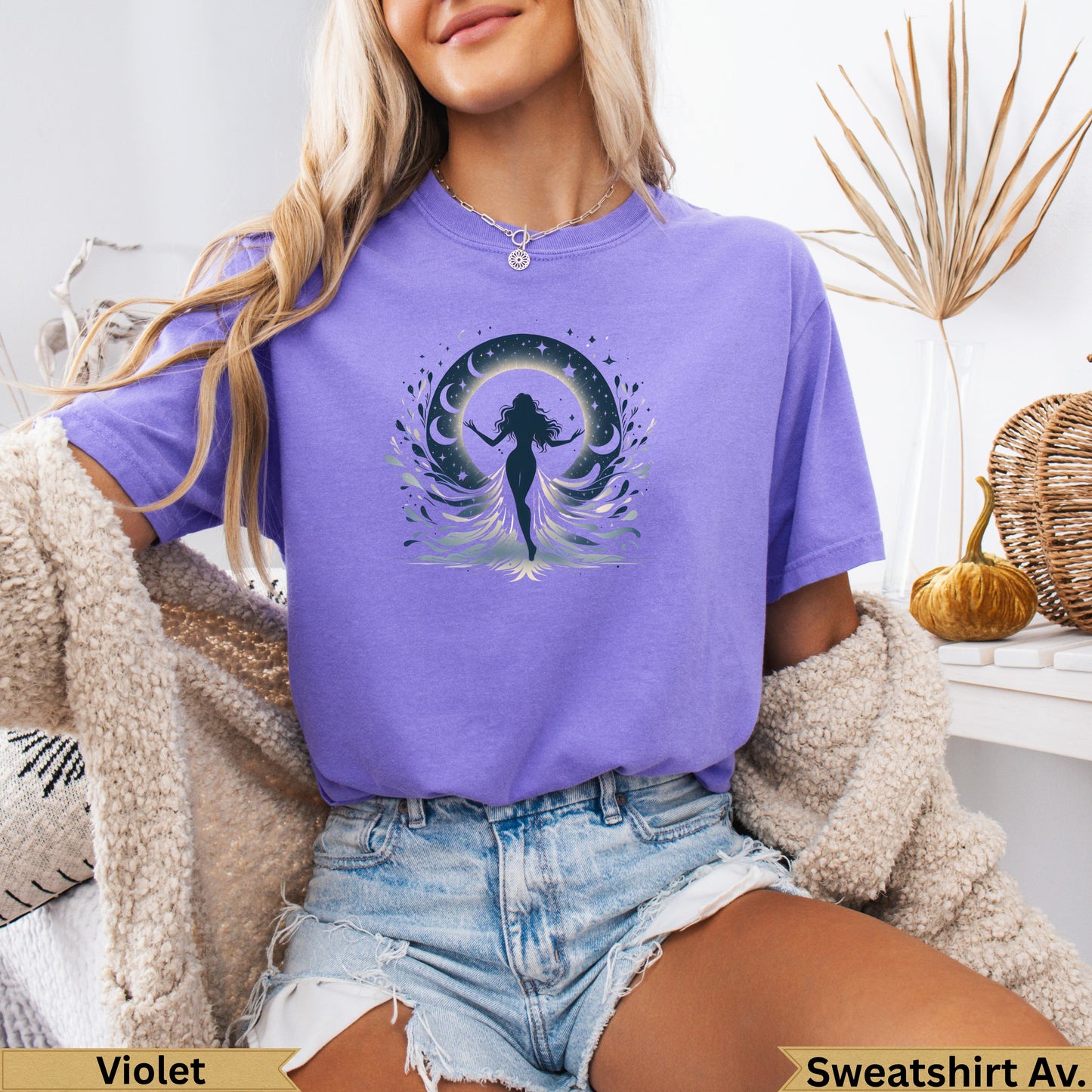 Purple t-shirt with graphic of a woman against a crescent moon and stars.