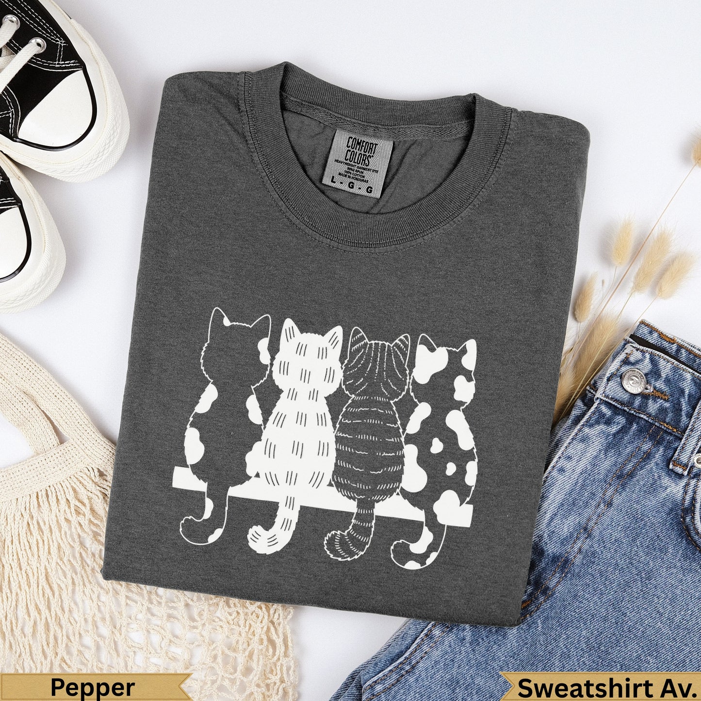 Charcoal Comfort Colors sweatshirt with four minimalist cats silhouetted on a white bench.