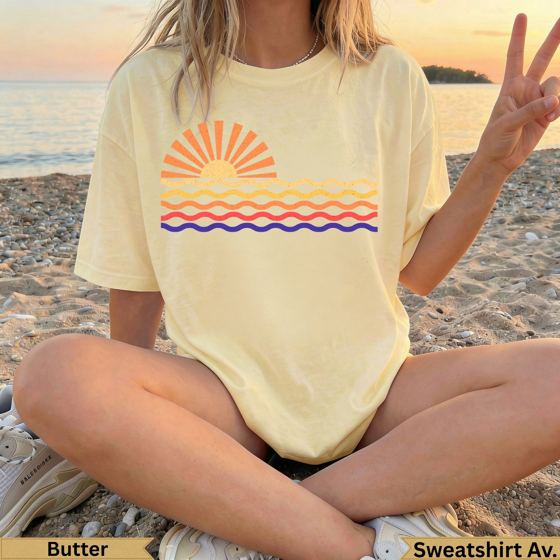Yellow t-shirt with stylized sun and wavy lines graphic.