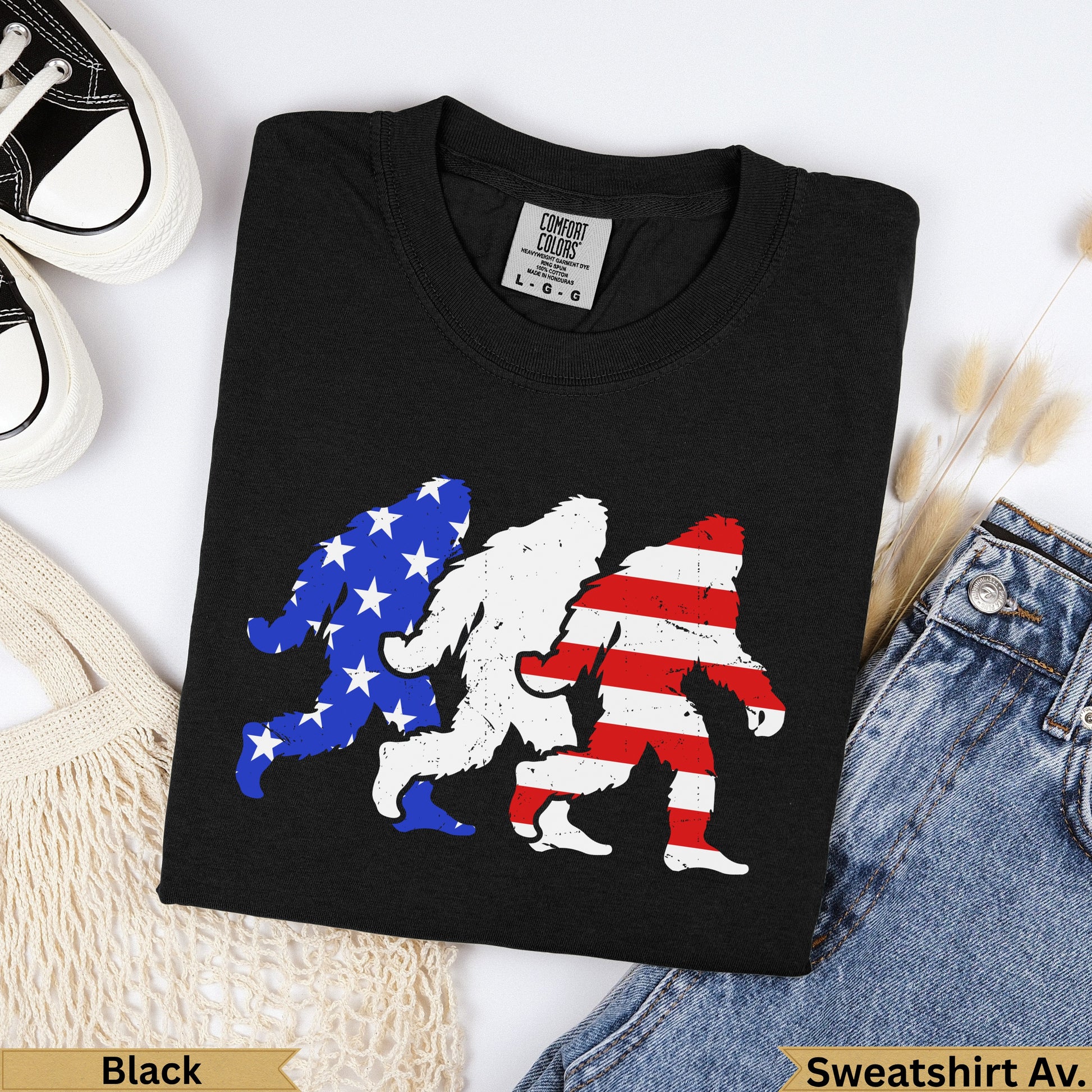 Black Bigfoot graphic t-shirt with American flag stripes and stars.