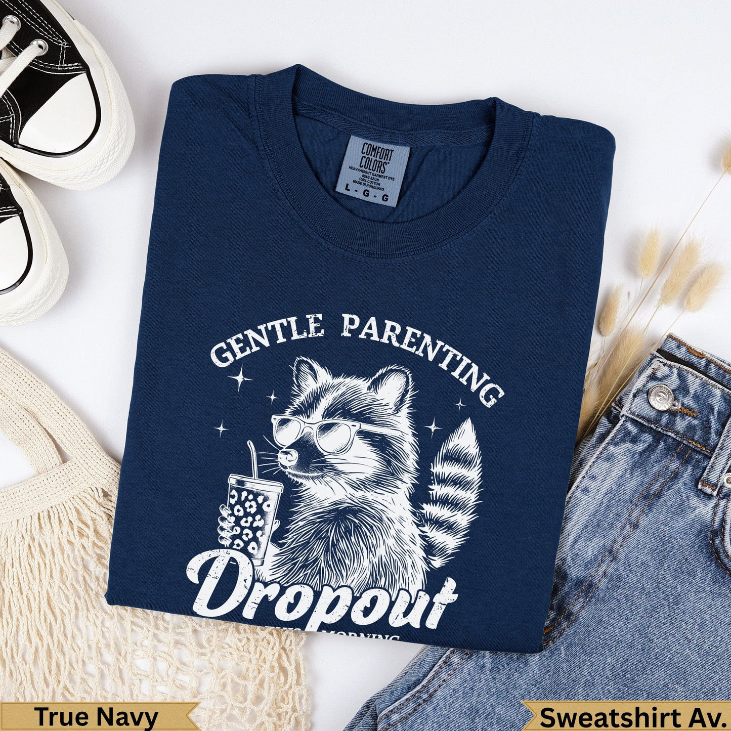 Navy sweatshirt with raccoon wearing sunglasses and text "Gentle Parenting Dropout".