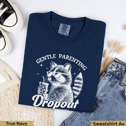 Navy sweatshirt with raccoon wearing sunglasses and text "Gentle Parenting Dropout".