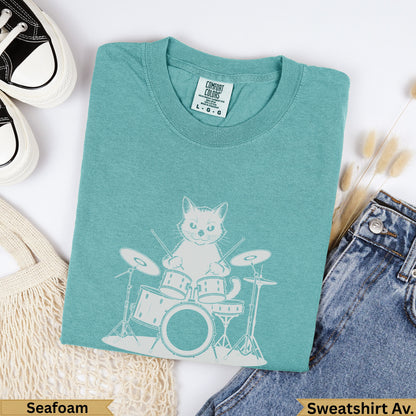 Seafoam Comfort Colors sweatshirt with a white graphic of a cat playing drums.